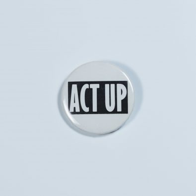 Button reading "ACT UP," referring to the ACT UP organization