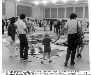 Folks viewing the AIDS memorial quilt at the Tom McEnery Convention Center hosted by ARIS. Photograph from the Ted Sahl Archives at SJSU.