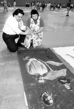 Folks viewing the AIDS memorial quilt at the Tom McEnery Convention Center hosted by ARIS. Photograph from the Ted Sahl Archives at SJSU.
