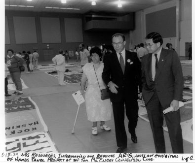 Folks viewing the AIDS memorial quilt at the Tom McEnery Convention Center hosted by ARIS. Photograph from the Ted Sahl Archives at SJSU.