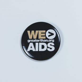 Button reading We > AIDS, greaterthan.org